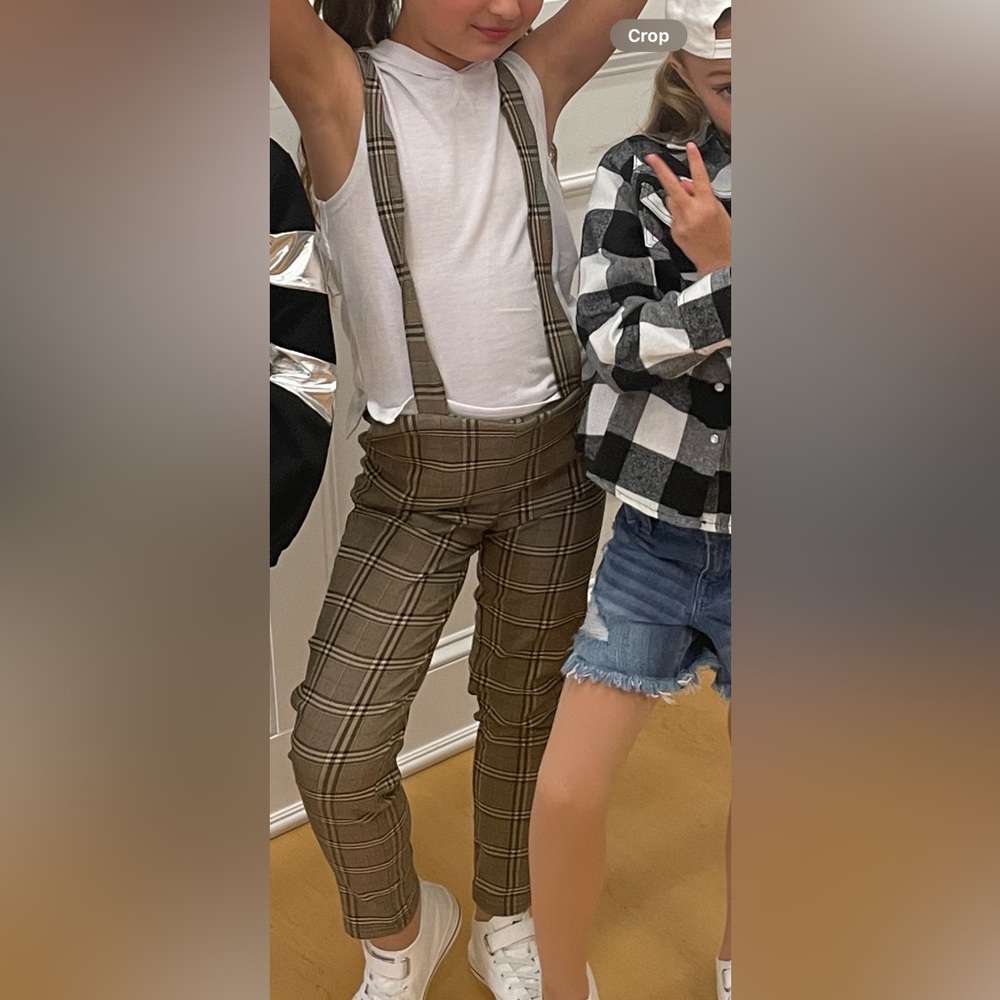 Plaid pants with suspenders and sleeveless hoodie